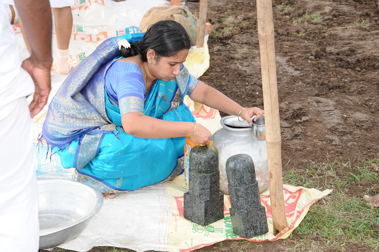 Foundation sacred water offering Sacred water offering during the temple foundation stone ceremony